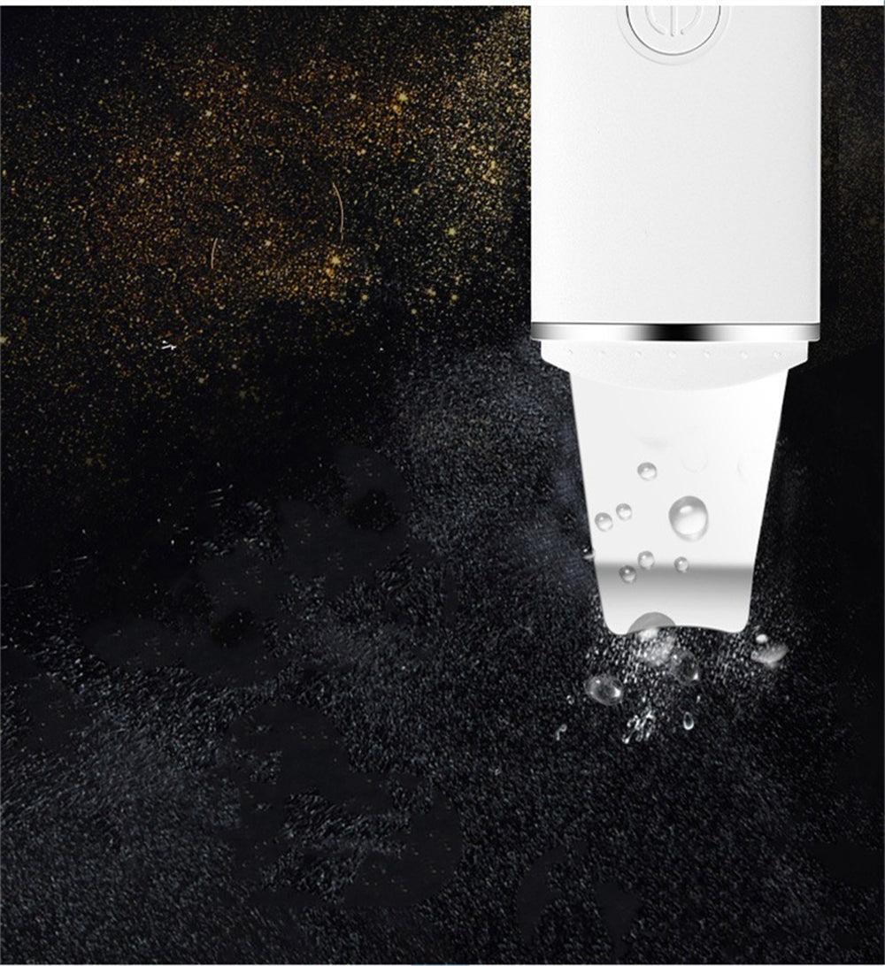White electronic device with water droplets on a dark textured surface