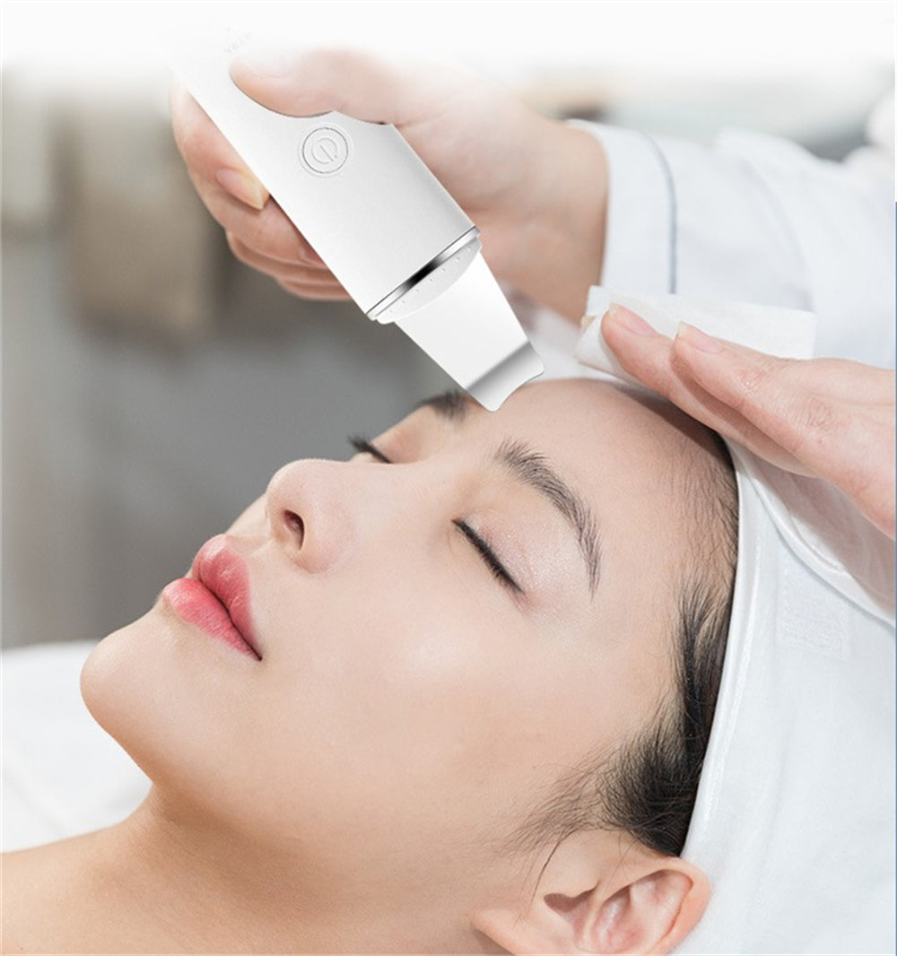 Person receiving a facial treatment with a device on their face